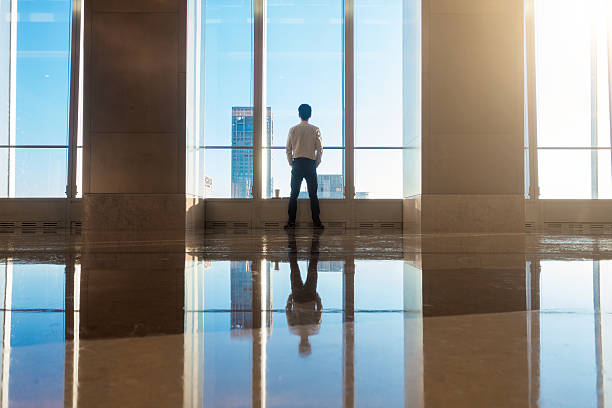 istock Businessman looking city through the window 503520162