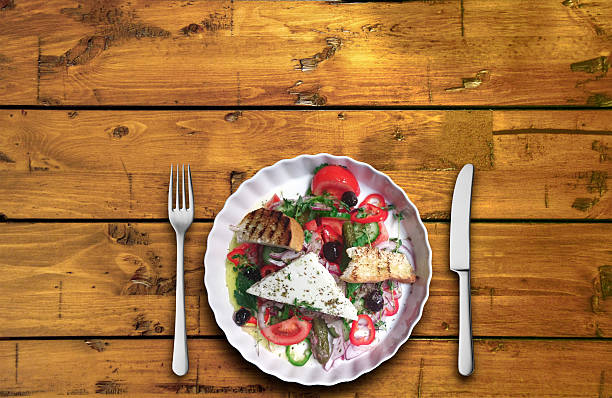istock Closeup of vegetable salad on a plank background 503520164