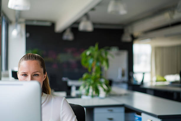 istock Businesswoman using desktop PC in office 503520200