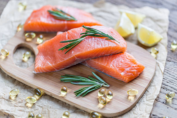 Sources of Omega-3 acid (salmon, Omega-3 pills) Sources of Omega-3 acid (salmon, Omega-3 pills) omega 3 and 6 stock pictures, royalty-free photos & images