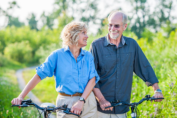 istock Senior couple biking 503523695