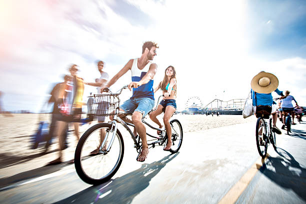 istock Couple riding tandem bicycle in LA 503524269