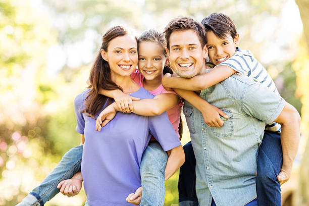 happy children piggyback ride disfrutar de sus padres - family white family with two children cheerful fotografías e imágenes de stock