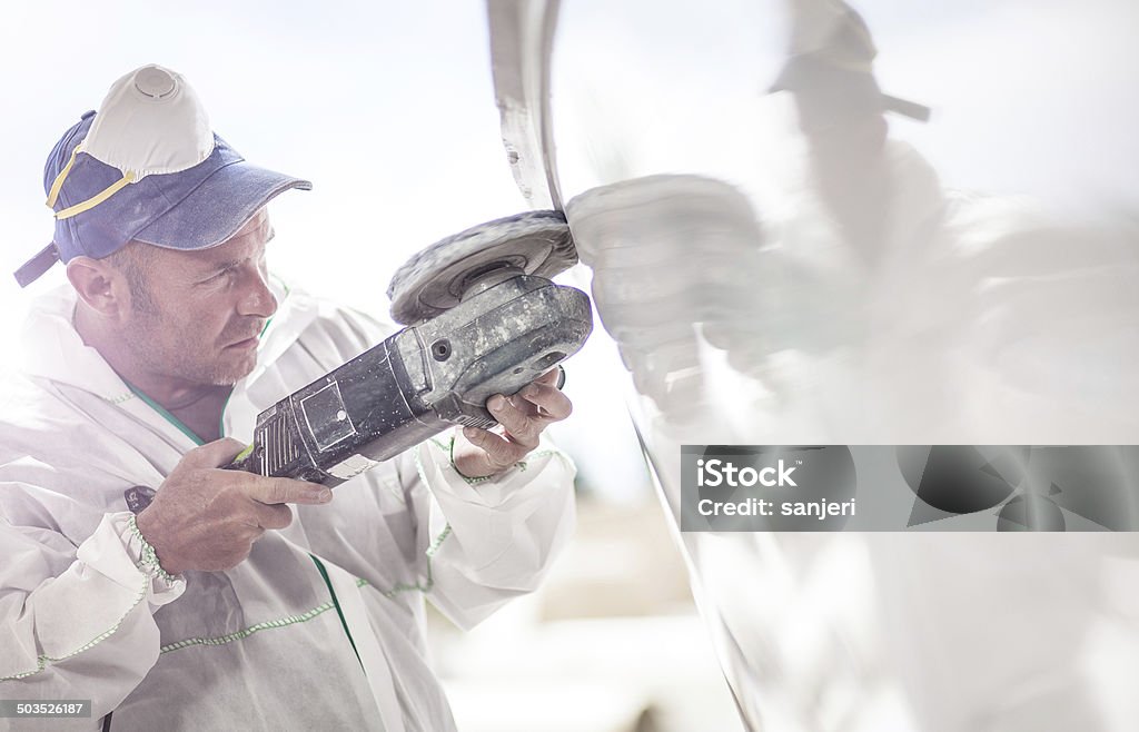 Man working with polyester, nautical service Accuracy Stock Photo