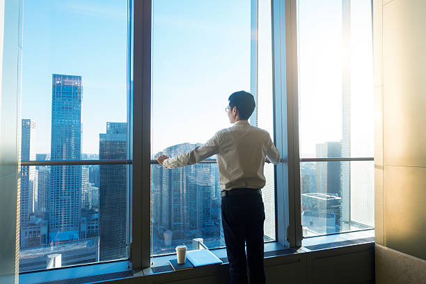 istock Businessman looking cityscape through the office window 503531454