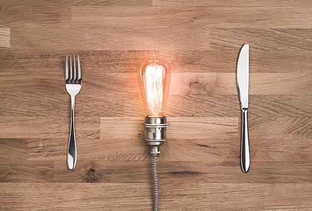Food for thought concept with vintage bulb Food for thought concept with vintage bulb on wooden background tungsten image stock pictures, royalty-free photos & images