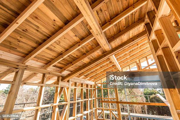 Wooden Frame Of A New House Under Construction Stock Photo - Download Image Now - Architecture, Below, Blue