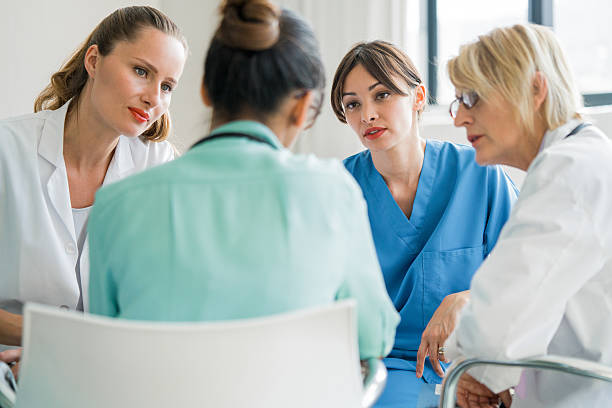 istock Multi-ethnic medical team discussing at hospital 503532516