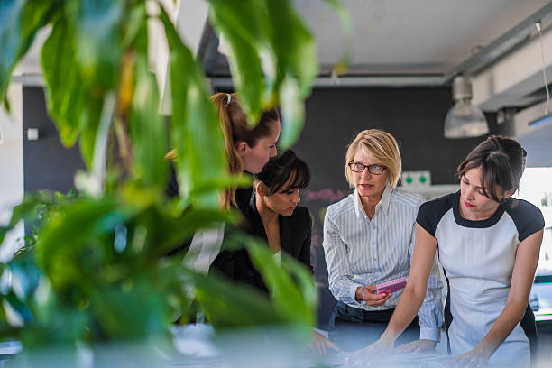 istock Multi-ethnic businesswomen discussing at workplace 503533018