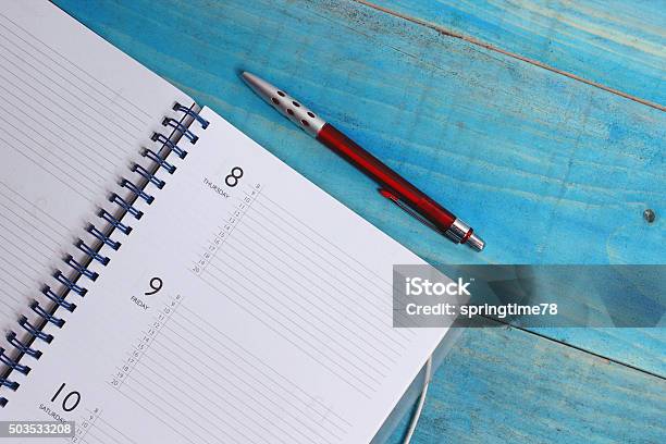 Planner And Pen Stock Photo - Download Image Now - Advice, Ballpoint Pen, Blue