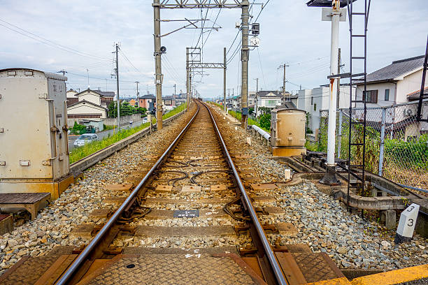 istock Railroad crossing , straight road ( Japan ) 503534128