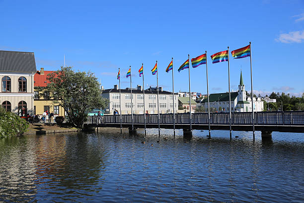 Reykjavik, Iceland - August 7, 2015: Lake Tjornin in the heart of Reykjavik. Its located beside the City Hall and is a popular place for Tourists and local people. The Free Church (Frikirkjan) of Reykjavik in the background 