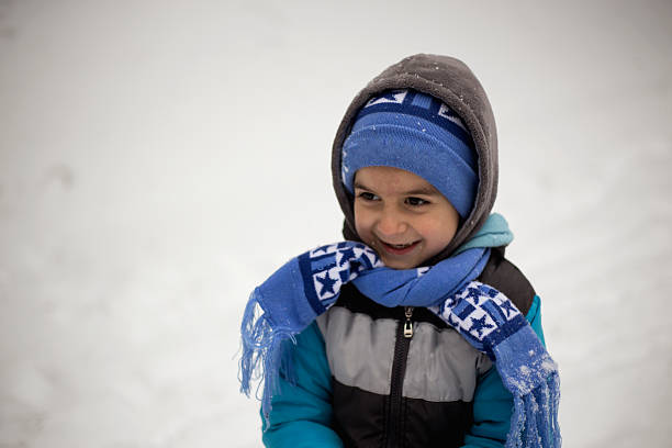 istock Little boy and the snow 503538482
