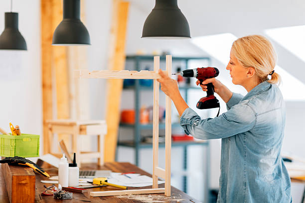 istock Carpenter drilling wooden plank 503538758