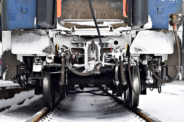 istock Train wagon buffers and links frozen in winter 503539152