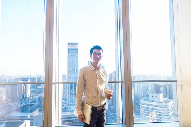 istock Businessman with coffee and laptop 503539692