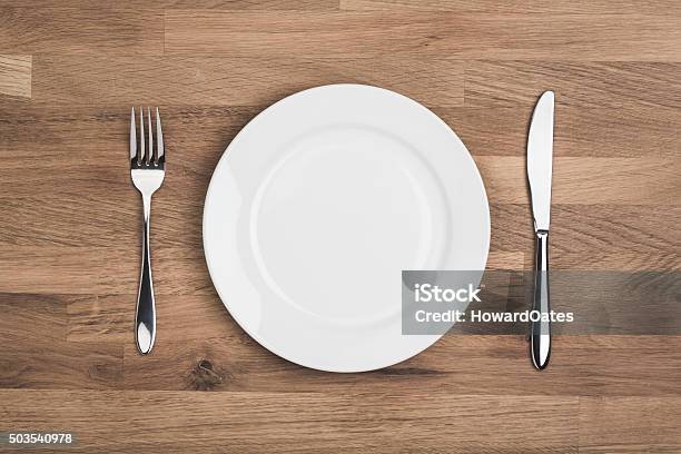 Empty White Plate With Knife And Fork Stock Photo - Download Image Now - Plate, White Color, Empty Plate