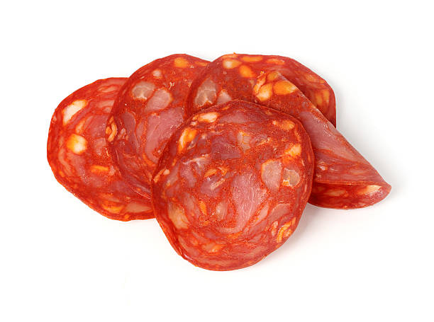 Chorizo slices Chorizo slices isolated on white salami stock pictures, royalty-free photos & images