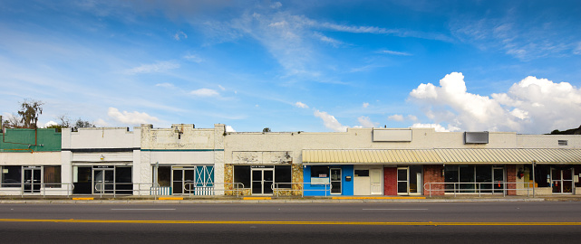 A row of empty, old retail storefronts in Williston, Florida.