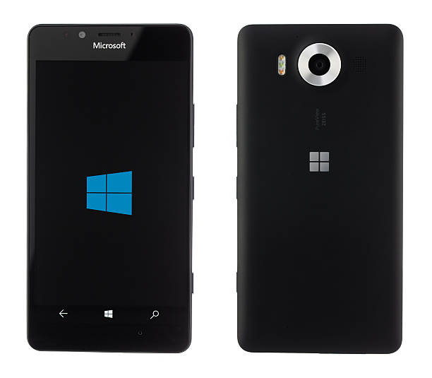 Varna, Bulgaria - December 10, 2015: Cell phone Microsoft Varna, Bulgaria - December 10, 2015: Cell phone model Microsoft Lumia 950 has 20 MP camera, Microsoft Windows 10 os,,Wireless charging and Iris scanner . Announced 2015, October phone nokia stock pictures, royalty-free photos & images
