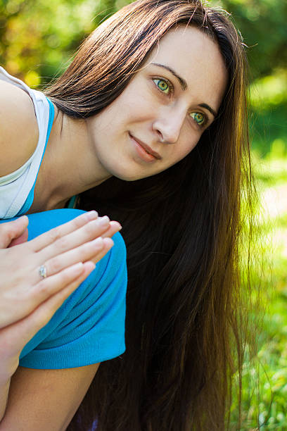 istock Young woman doing yoga in park 503560010