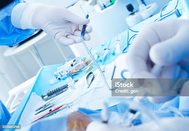 Surgeons In Action Stock Photo - Download Image Now - A Helping Hand, Assistance, Assistant