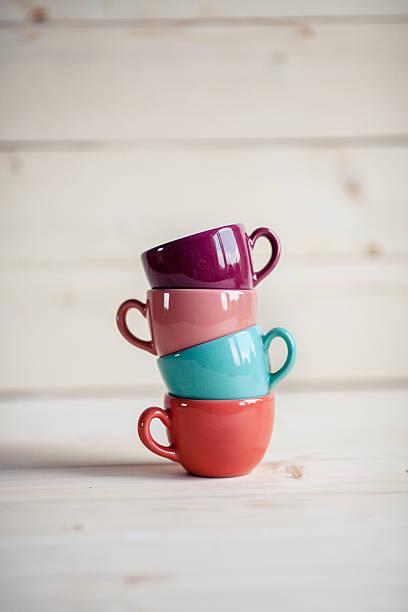 istock coffee colorful cups on wooden background 503566027