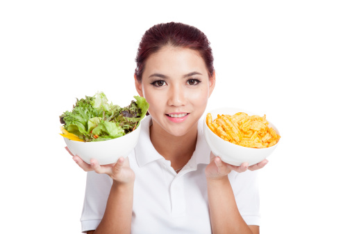 Asian girl smile with crisps and salad  isolated on white background