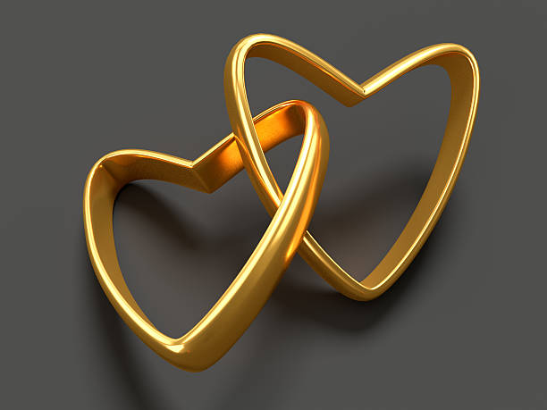 istock Two gold hearts rings 503567900