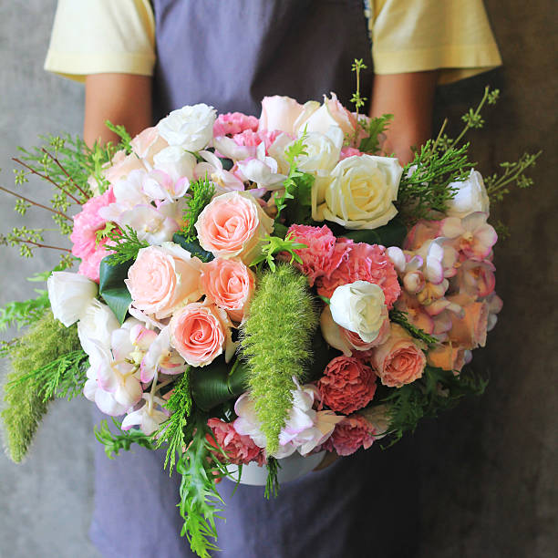 istock Florist holding bouquet 503567987