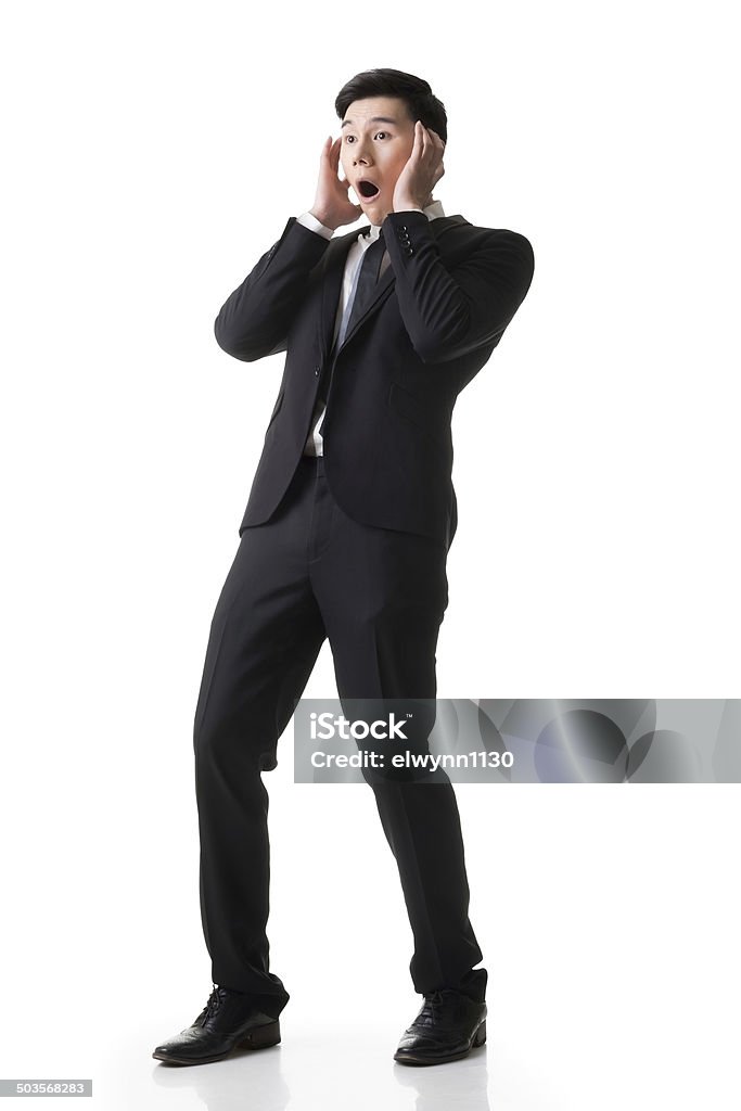 Asian business surprised Asian business surprised with outrageously and funny pose, full length portrait isolated on white background. Business Person Stock Photo