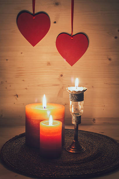 istock Romantic arrangement with hearts and candles 503568558