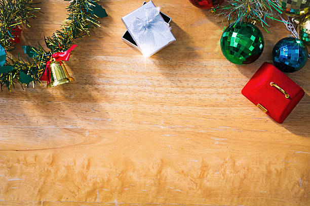 istock New year background with gift box on wooden texture. 503568738