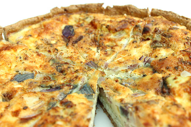 istock Sliced homemade bacon and egg quiche tart / savoury flan image 503569089