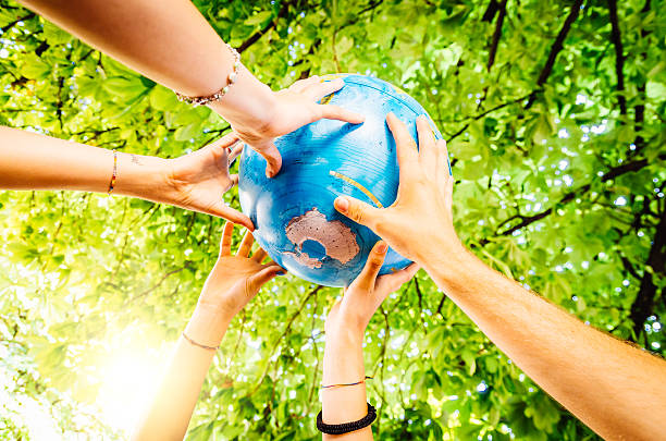Friends holding the world