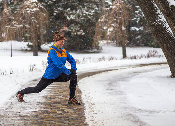istock Young sport woman doing exercises during winter training outside in 503577972