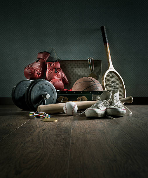 Teenager sports equipment Teenager sport equipment in a vintage suitcase including sports footwear, boxing gloves, weights and baseball bat. Barbell stock pictures, royalty-free photos & images