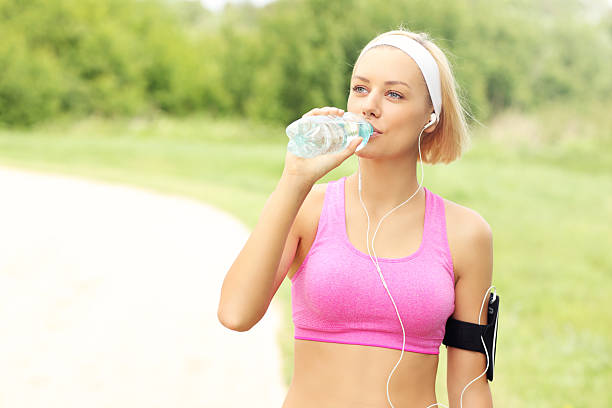 istock Jogger drinking water in the park 503580768