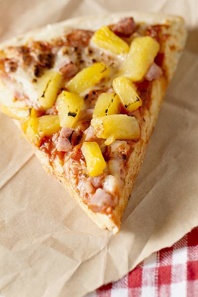 hawaiian pizza slice stock photo