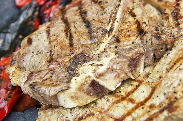 istock grilled bbq t bone steak with roasted red peppers 503583498