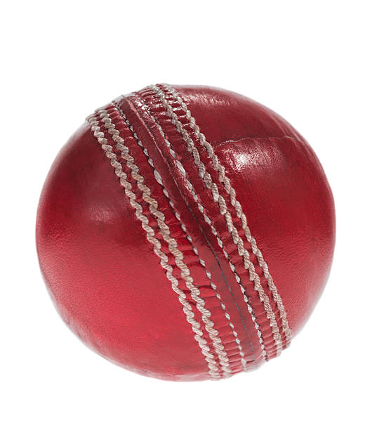 istock Red Leather Cricket ball on white background 503584196