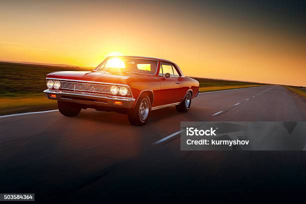Retro Car Chevrolet Malibu 1960s Drive Speed On Road Sunset Stock Photo - Download Image Now