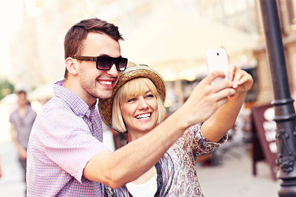 istock Happy couple taking a picture of themselves while sightseeing 503586114