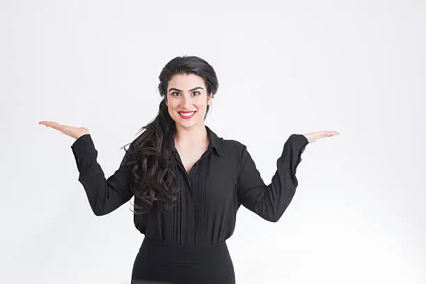 woman with hands up over white background