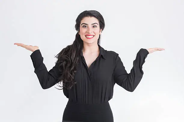 business woman smiling with hands up over white background