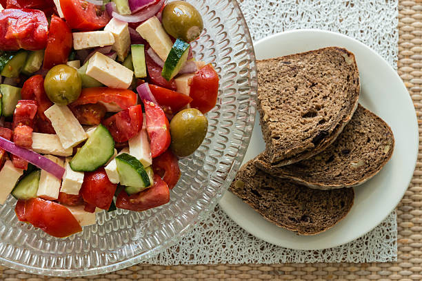 istock Greek salad with bread slices 503588426