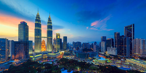 Kuala Lumper skyline at twilight Top view of Kuala Lumper skyline at twilight twin towers malaysia stock pictures, royalty-free photos & images