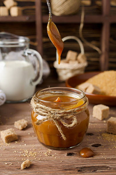 istock Homemade caramel sauce on wooden table 503590384