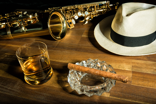 Saxophone, rum, panama hat and a cigar