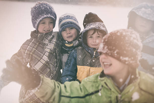 istock Children playing and having fun during a big winter storm 503590868